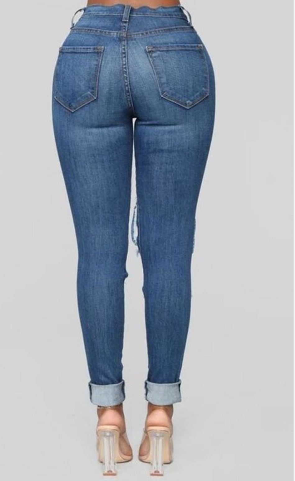 Vaqueros ajustados de talle alto con roturas de Denim Queen
